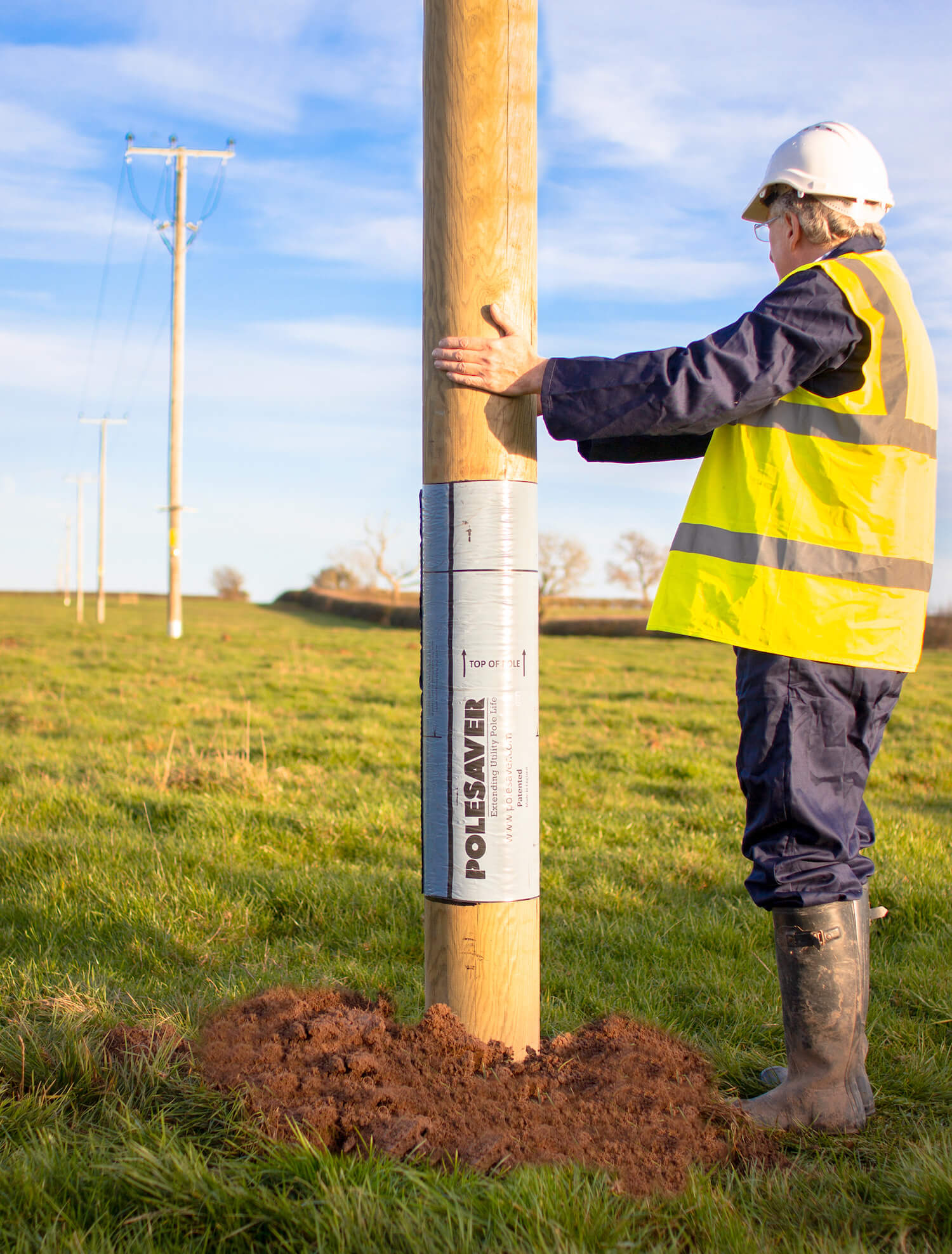 Polesaver Sleeved Utility Pole in Field Polessaver Sleeve - Utility Pole Protection