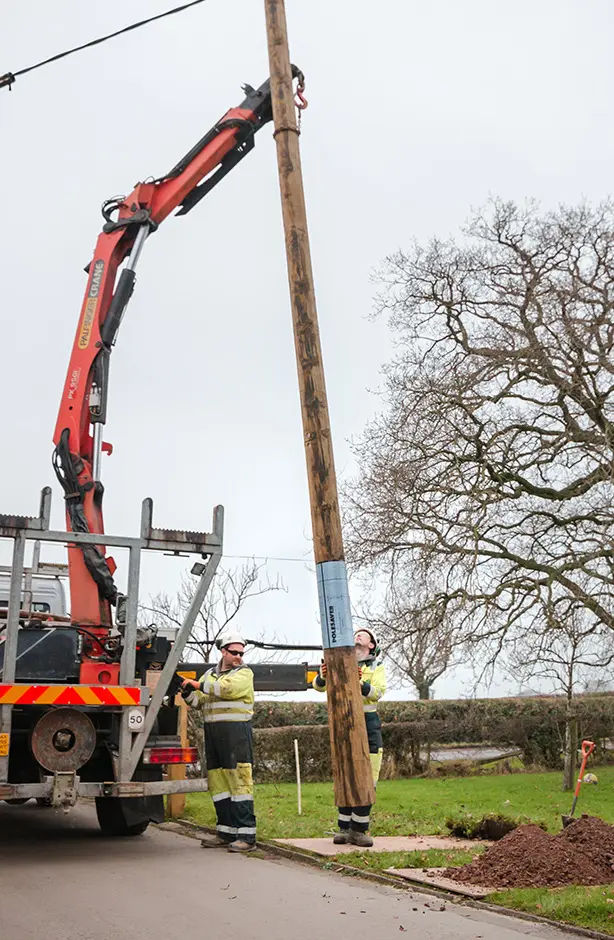 Utility Pole Lifted Off Truck Polesaver protected pole being lifted off the truck